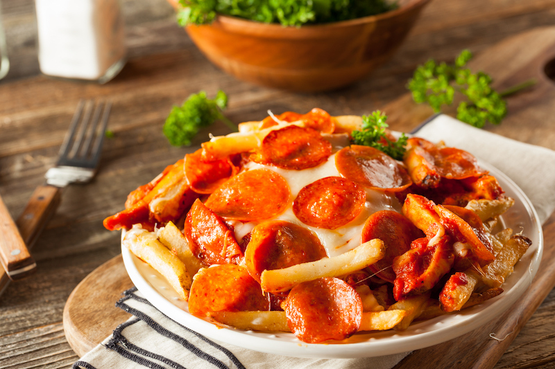 Pizza fries topped with pepperoni and melted cheese