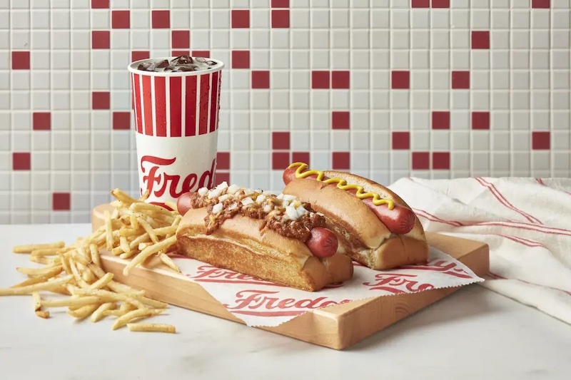 Two hot dog combo with fries and a drink from Freddy’s on a tray