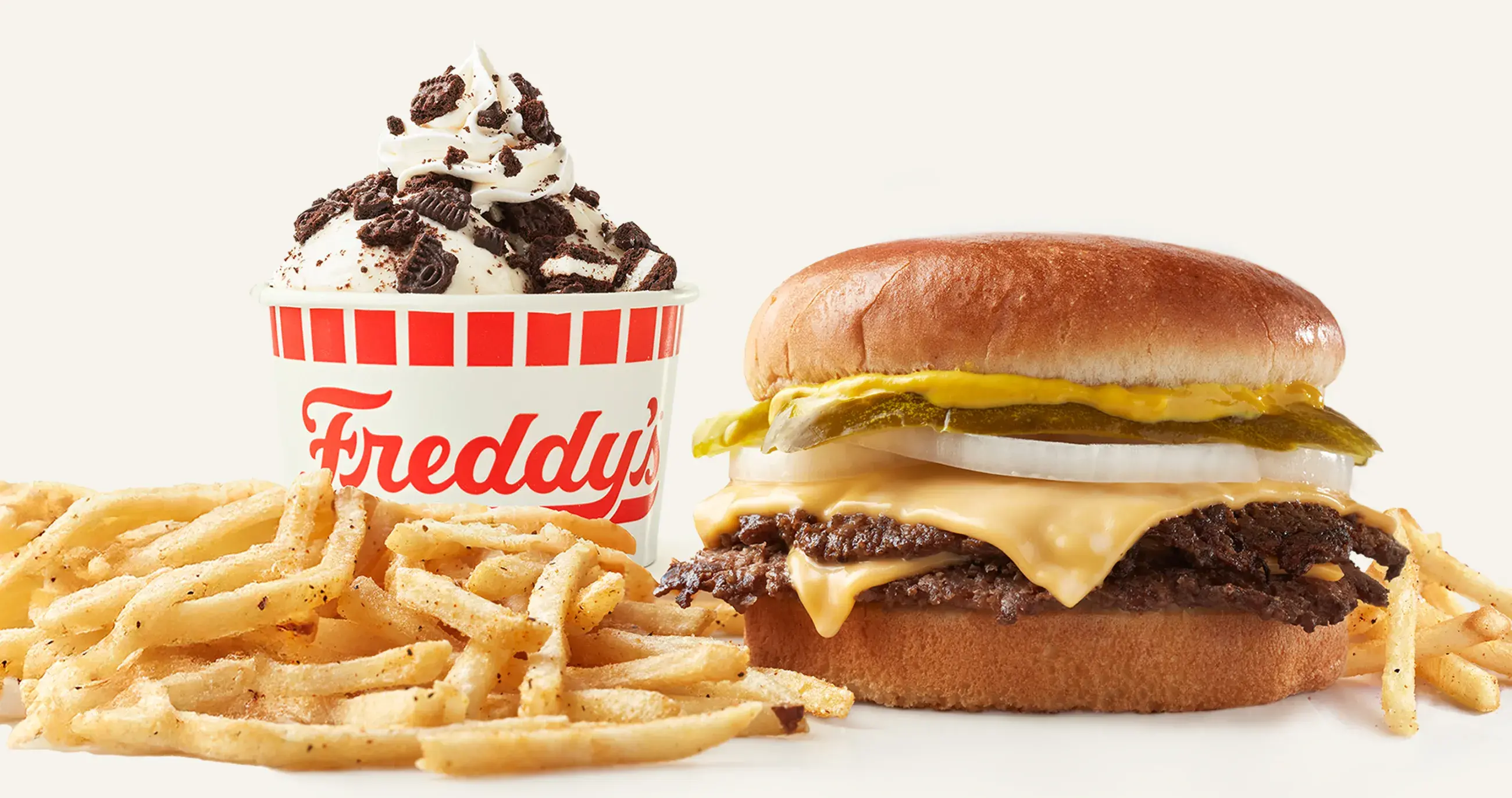 Freddy's cheeseburger with crispy fries and a frozen custard.